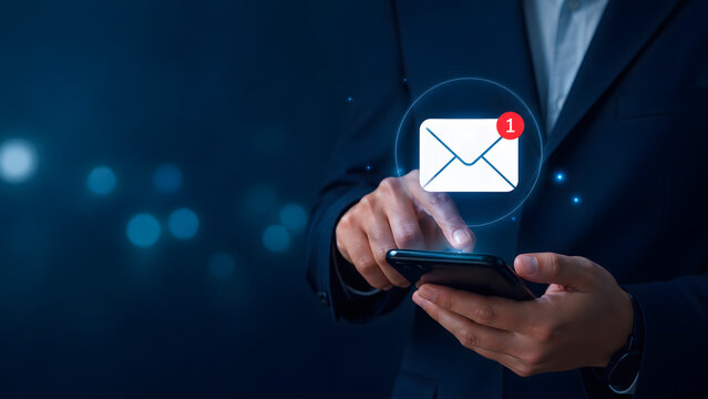 man holding a mobile phone with email symbol