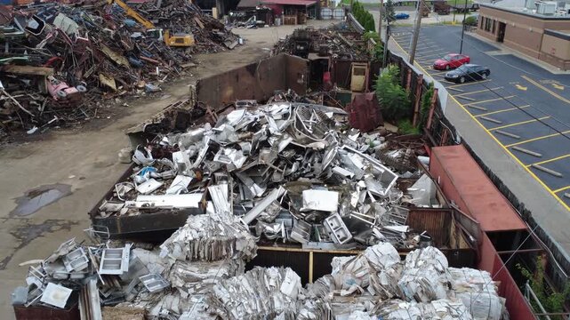 Scrap metal yard filled with various types of discarded and scrap metal