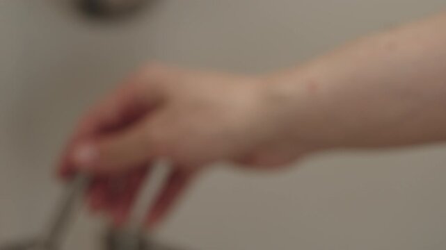 Slow motion man hand wash fresh ripe raspberries