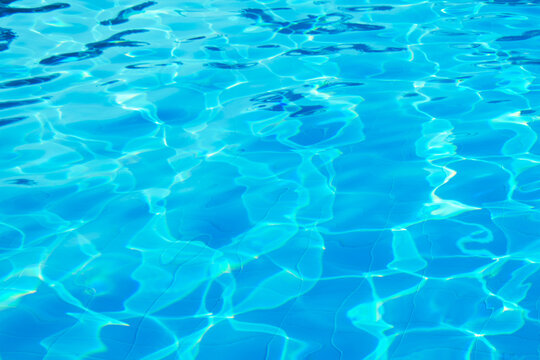 surface of blue swimming pool, background of water in swimming pool.