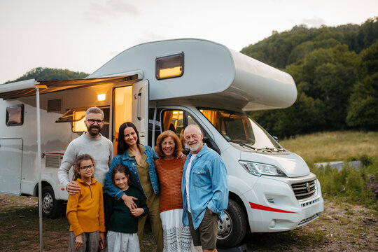 Multigenerational family enjoying summer caravan vacation.