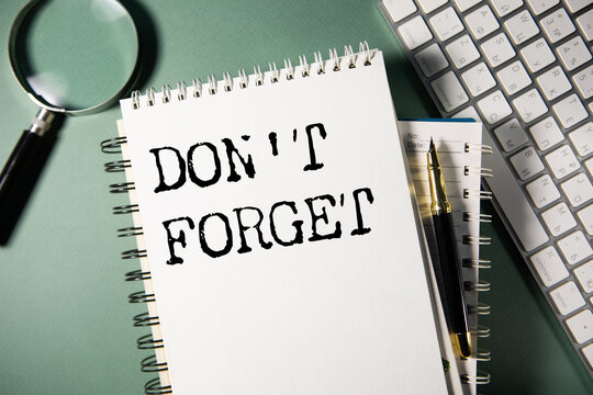 Don't Forget handwritten message on sticky note