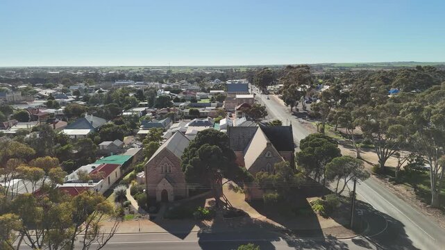 St Peter's Anglican Church, Moonta, Yorke Peninsula, South Australia &ndash; 4K aerial drone view of historic heritage church, Gothic architecture, Copper Coast, reidential houses, estates