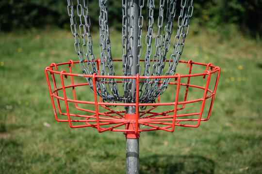 red disc golf basket