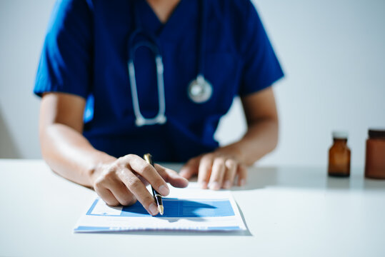 Professional healthcare worker calculating finance and budget data on a calculator. Medical accounting for cost analysis