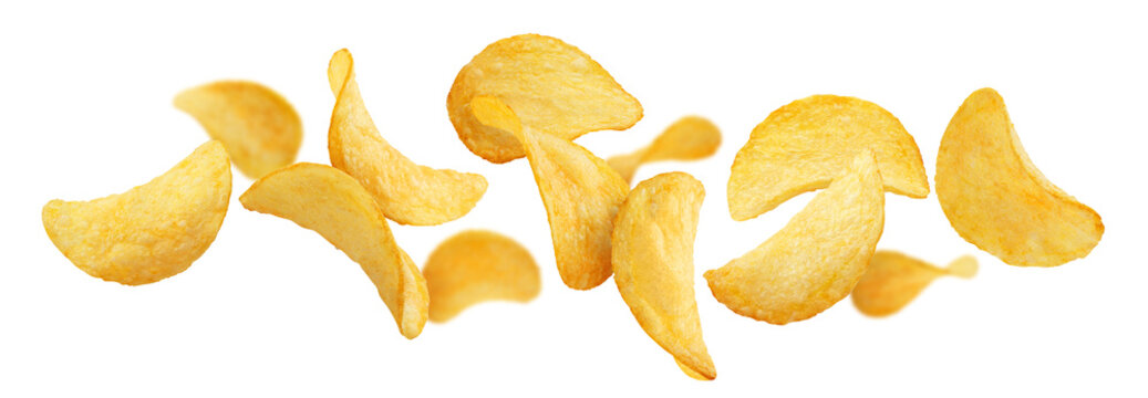 Delicious golden potato chips flying in dynamic composition, isolated on transparent cutout background