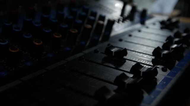 Professional DJ Sound Mixer Panel with Mute Solo Buttons and Sliders Close Up