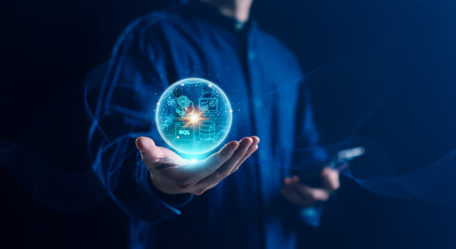 Person holding a glowing AI and data interface with SQL, database and analytics symbols, illustrating artificial intelligence, automation, data technology and digital transformation.