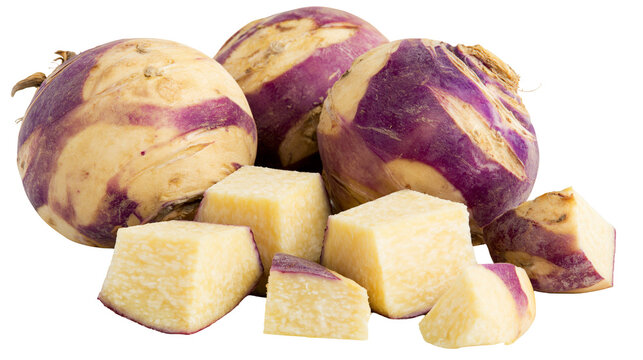 Whole and cubed rutabaga root vegetables with purple skin and yellow flesh