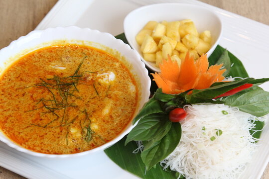 Authentic Thai crab curry with coconut milk, shredded kaffir lime leaves, served with white rice noodles