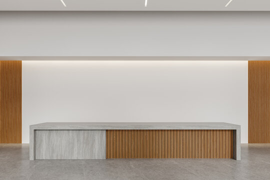 Modern minimalist interior with concrete reception desk and warm vertical wood slat wall, spacious architectural workspace design. 3D Rendering