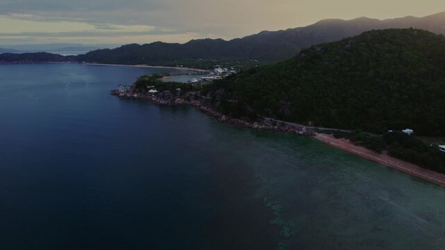 Aerial approaching Nelly Bay along the coast of Magnetic Island, Queensland