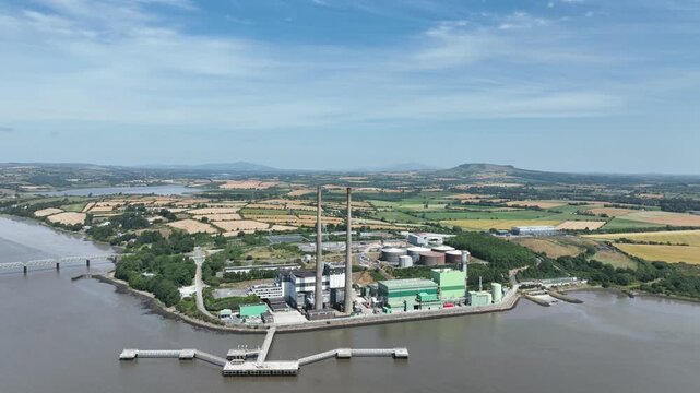 Drone footage capturing the contrast between heavy industry and the tranquil River Suir landscape in County Wexford, Ireland.