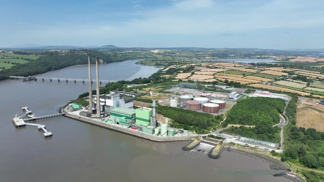High-quality drone footage of Irish electricity infrastructure on the River Suir, showing riverside industry and panoramic estuary views.