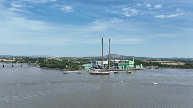 Professional aerial stock footage of an electricity power plant on the River Suir in County Wexford, Ireland