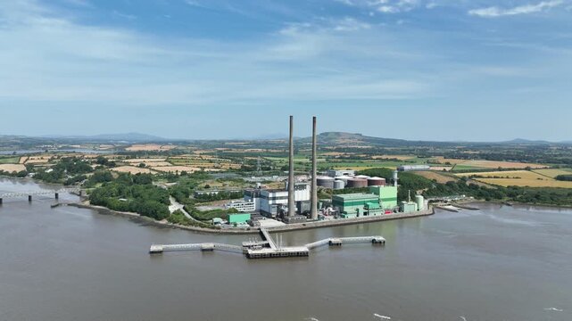 Sweeping aerial video of a power station along the River Suir in County Wexford, highlighting energy production