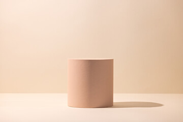 Empty beige design scene with round pedestal and long shadow for product mockup, packaging...
