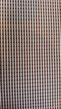 Woven texture with geometric pattern in white brown and black stripes 