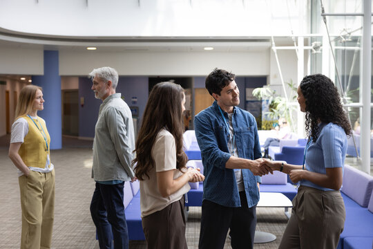 Business colleagues shaking hands in a networking event