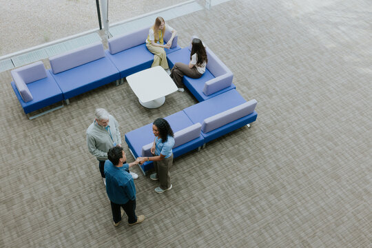 Overhead shot of Professionals Networking in a Stylish Office Space