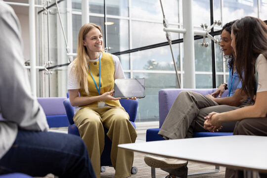 Group discussion with a young businesswoman presenting