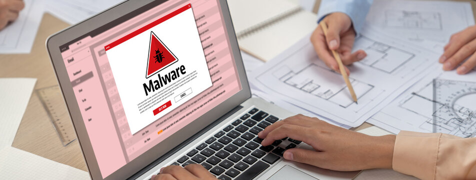 Cyber attacking concept. Malware alert showing on computer screen display scam and threat detection on computer system or online server to be removed brisk.