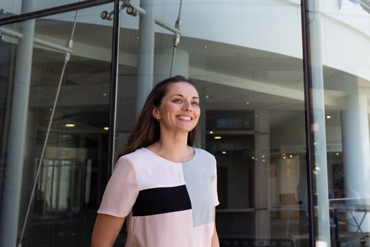 Smiling businesswoman walks confidently to work