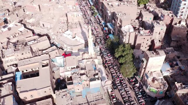 Old Cairo Egypt Aerial Cinematic Drone Shot Overcrowded Residential Street with Minaret and Traditional Buildings - D-Log RAW Ungraded DJI Footage