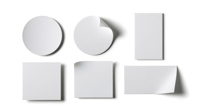  mockup of an organized set of blank matte white stickers on a transparent background. 