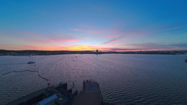 Aerial drone footage of yachts and boats on Cardiff Bay Barrage at sunset