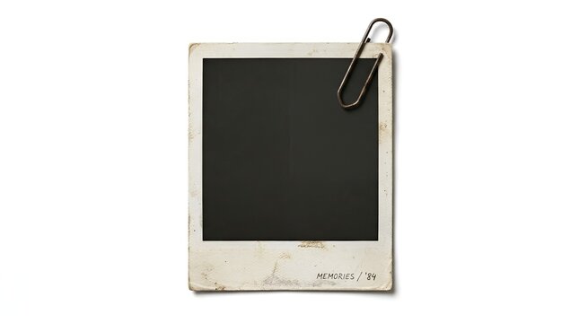A blank vintage instant photo print, complete with a metallic paper clip, ready for customization or display