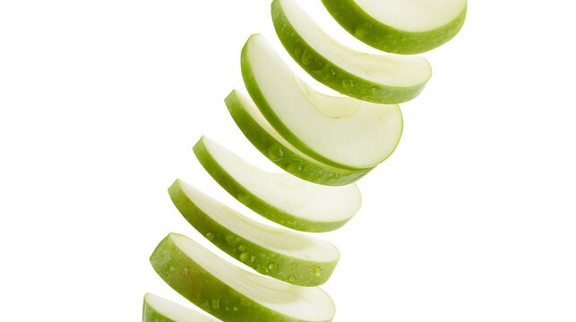 Green apple slices spiral falling