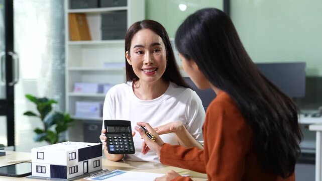 Considering buying a home, investing in real estate. Broker signs a sales agreement. agent, lease agreement, successful deal.