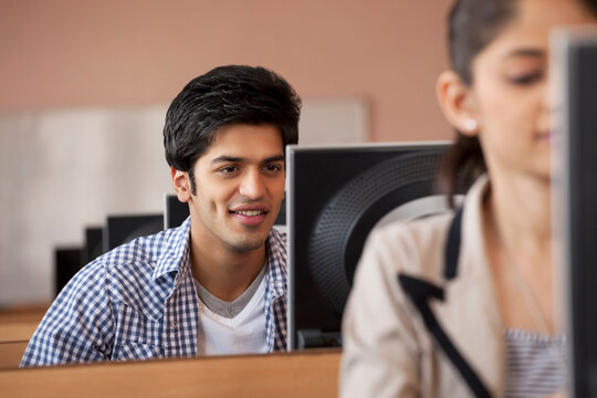 College student looking at computer