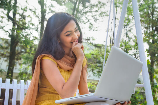 Woman surfing the net on a laptop