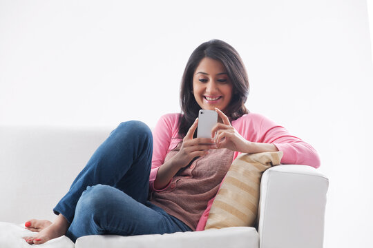 Young woman using her cell phone
