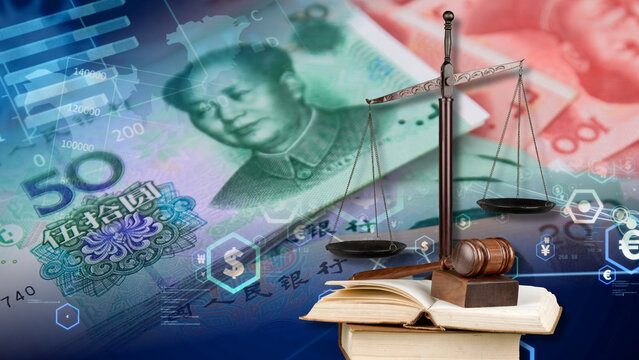 The Chinese financial and legal data display features Chinese yuan banknotes, a scale of justice, a judge gavel, and open law books to show the economic impact of China's trade laws, financial 