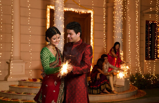 Couple playing with sparklers