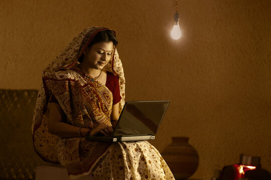 Rural woman working on laptop