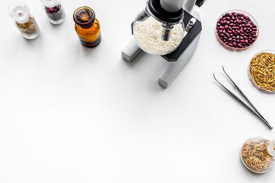 Food analysis. Rice under the microscope on white background top view copy space