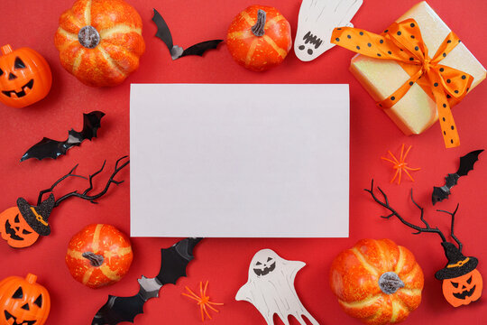 Halloween blank card mockup with pumpkins gift box and ghost decorations