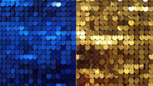 Split background of blue and gold sequin textures.