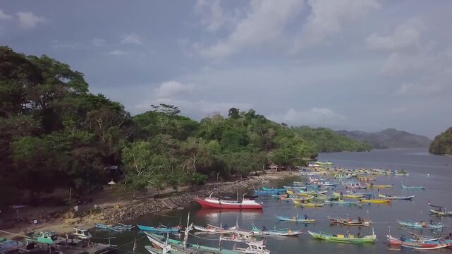 Aerial View of Indonesian Traditional Wooden Fishing Boats in Coastal Bay