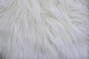Fluffy white artificial fur texture background with soft long pile © Natalia
