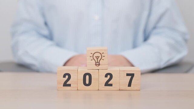 2027 year block with lightbulb. Business Idea, Creative, Thinking, brainstorm, Goal, Resolution, strategy, plan, Action, change and New Year start concepts