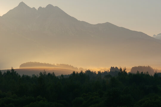 lomnicky stit mountain peak in slovakia high tatras landscape view sunset misty glow nature rocky summit concept of travel, tourism, nature