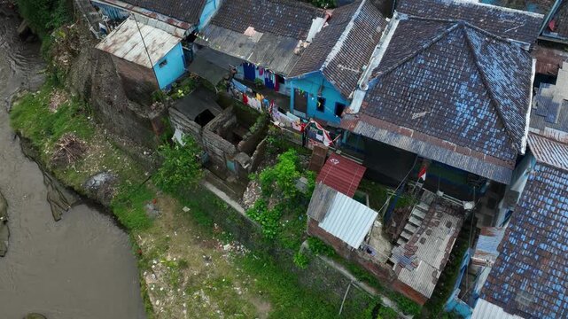 Aerial Dolly In Above Rooftops of Arema Blue Village Kampung Biru Arema in Malang, East Java, Indonesia
