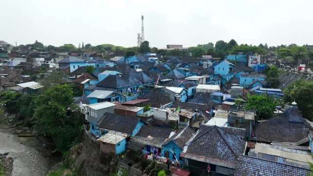 Aerial Establishing of Arema Blue Village Kampung Biru Rooftops in Malang East Java Indonesia