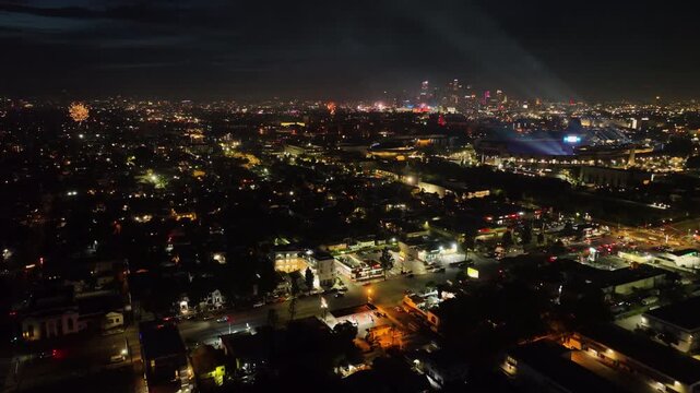 Aerial view over the Los Angeles cityscape, fireworks on Independence day night