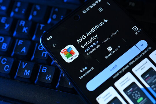 VEHARI, PAKISTAN - JULY, 30, 2026: AVG AntiVirus Close Up Smartphone with Keyboard and Screen